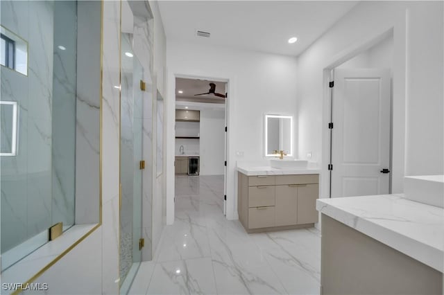 13 NW 14th Ave, Cape Coral, FL 33993 - full bathroom featuring marble finish floors, vanity, a marble finish shower, and recessed lighting