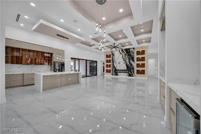 13 NW 14th Ave, Cape Coral, FL 33993 - unfurnished living room featuring wine cooler, light marble finish flooring, recessed lighting, coffered ceiling, and a ceiling fan