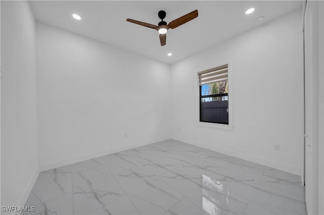 13 NW 14th Ave, Cape Coral, FL 33993 - unfurnished room with baseboards, marble finish flooring, and recessed lighting