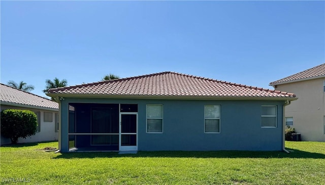 12635 Stone Tower Loop, Fort Myers, FL 33913 - back of property with a lawn, a tiled roof, and stucco siding