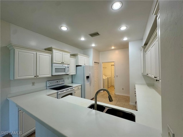 12635 Stone Tower Loop, Fort Myers, FL 33913 - kitchen with white appliances, a sink, light countertops, recessed lighting, and white cabinetry