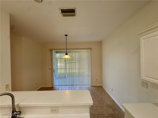 12635 Stone Tower Loop, Fort Myers, FL 33913 - unfurnished dining area featuring tile patterned floors and baseboards