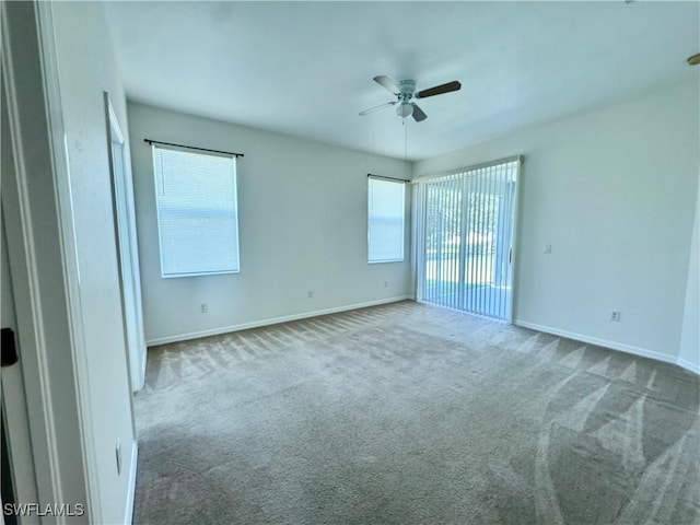 12635 Stone Tower Loop, Fort Myers, FL 33913 - empty room featuring carpet flooring, a ceiling fan, and baseboards