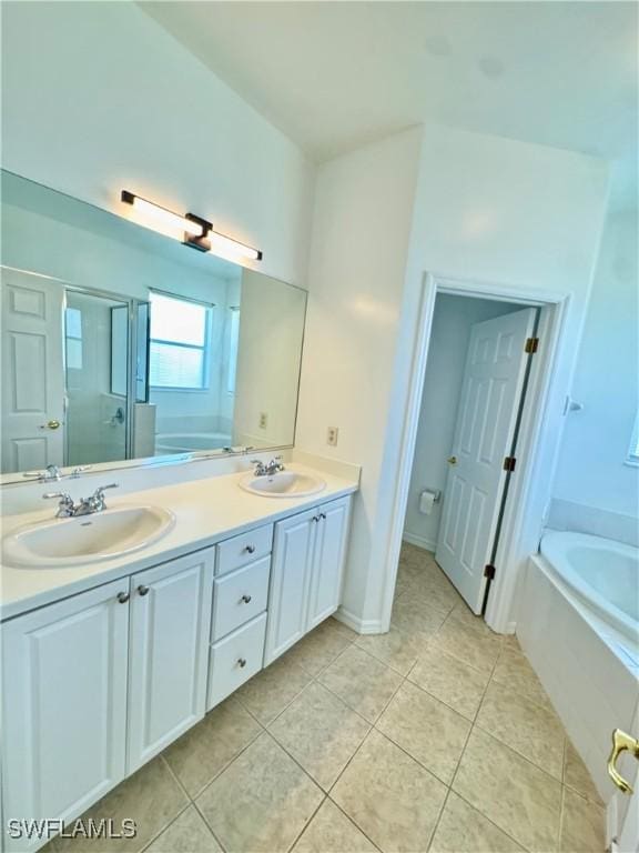 12635 Stone Tower Loop, Fort Myers, FL 33913 - full bath featuring tile patterned floors, double vanity, a bath, and a stall shower