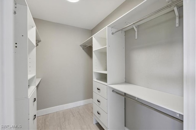 5748 Linden Ln, Bokeelia, FL 33922 - walk in closet featuring light wood-style floors
