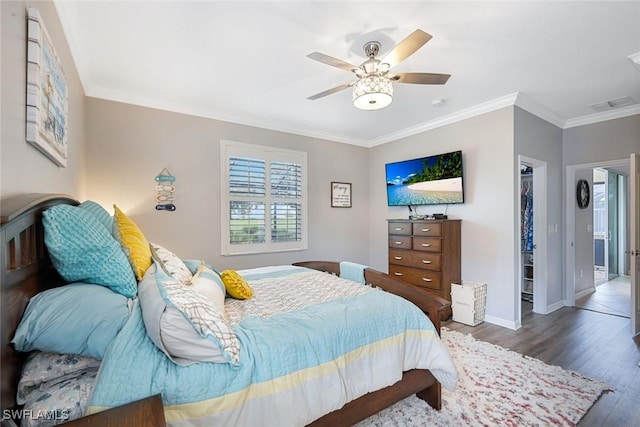 3147 Walnut Grove Ln, Alva, FL 33920 - bedroom with a walk in closet, wood finished floors, baseboards, ornamental molding, and a closet