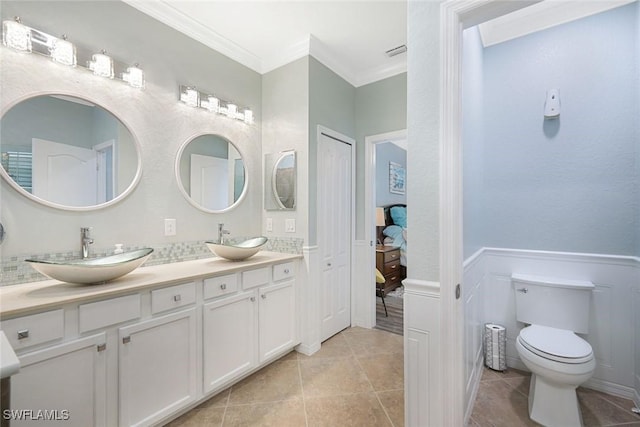 3147 Walnut Grove Ln, Alva, FL 33920 - bathroom featuring double vanity, ensuite bath, ornamental molding, tile patterned floors, and toilet