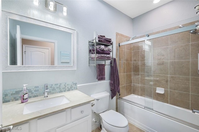 3147 Walnut Grove Ln, Alva, FL 33920 - bathroom with toilet, vanity, combined bath / shower with glass door, and tasteful backsplash