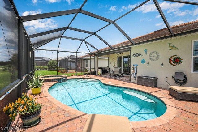 3147 Walnut Grove Ln, Alva, FL 33920 - view of pool with a patio, a pool with connected hot tub, a ceiling fan, and glass enclosure
