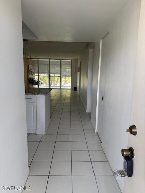 3910 Inverrary Blvd Unit 407-B, Lauderhill, FL 33319 - hallway with light tile patterned floors