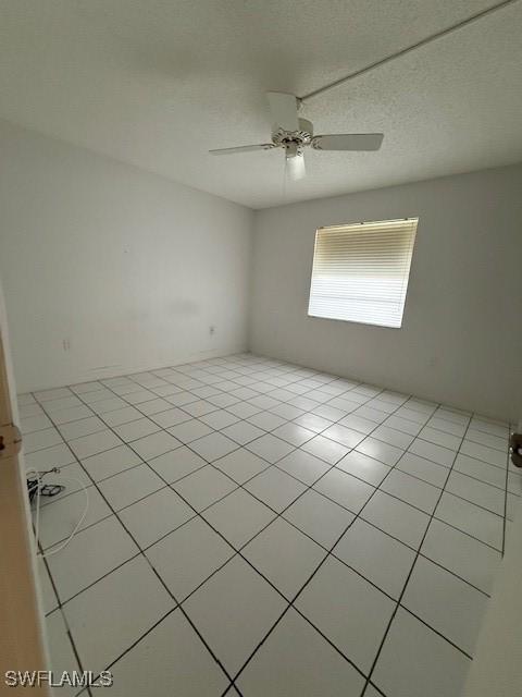 3910 Inverrary Blvd Unit 407-B, Lauderhill, FL 33319 - empty room with a ceiling fan and light tile patterned floors