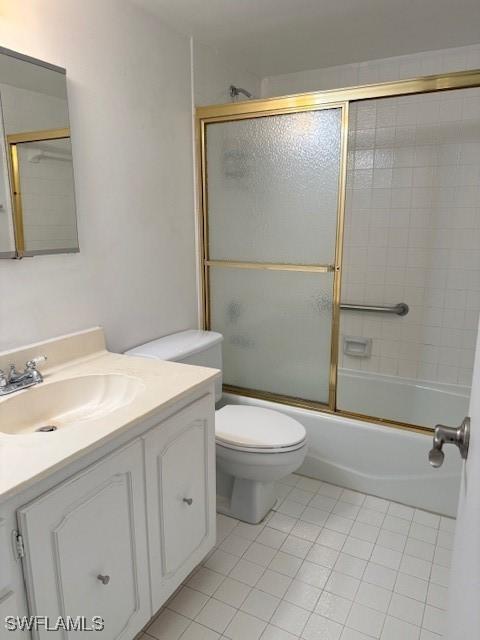 3910 Inverrary Blvd Unit 407-B, Lauderhill, FL 33319 - full bath featuring tile patterned flooring, vanity, combined bath / shower with glass door, and toilet
