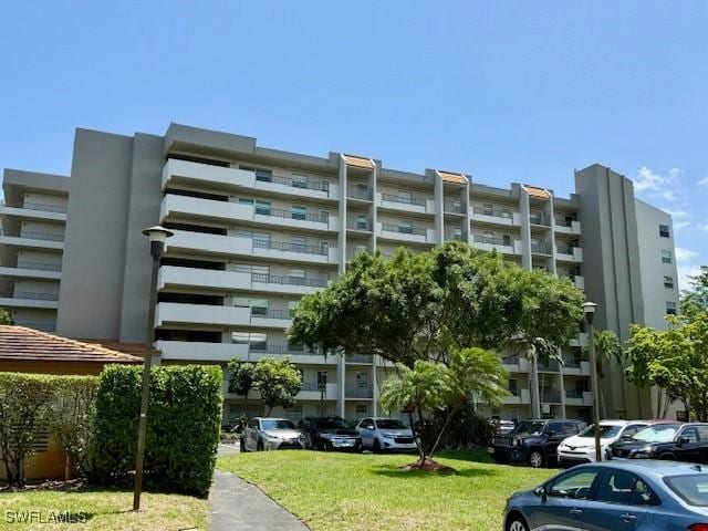 3910 Inverrary Blvd Unit 407-B, Lauderhill, FL 33319 - view of apartment building / complex with uncovered parking