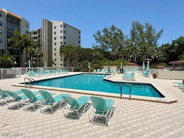 3910 Inverrary Blvd Unit 407-B, Lauderhill, FL 33319 - community pool featuring a patio