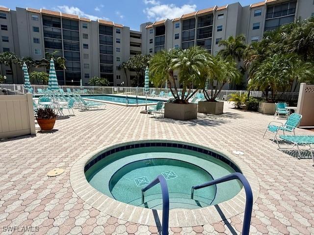 3910 Inverrary Blvd Unit 407-B, Lauderhill, FL 33319 - community pool with a patio and a community hot tub