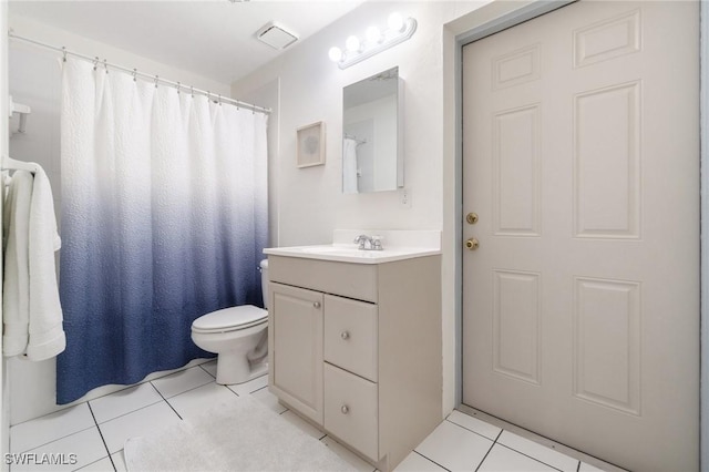 740 106th Ave N, Naples, FL 34108 - bathroom with vanity, toilet, and tile patterned floors