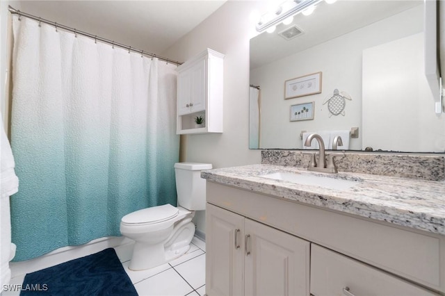 740 106th Ave N, Naples, FL 34108 - full bath with toilet, tile patterned flooring, vanity, and curtained shower