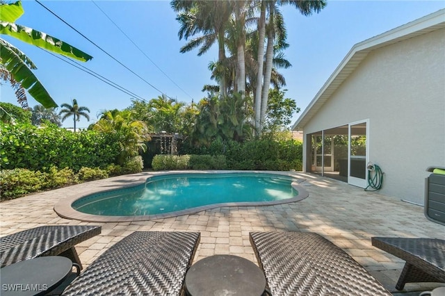 740 106th Ave N, Naples, FL 34108 - swimming pool featuring a patio area
