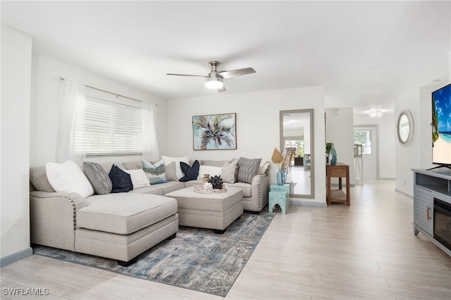 740 106th Ave N, Naples, FL 34108 - living area featuring wood finished floors, ceiling fan, and baseboards