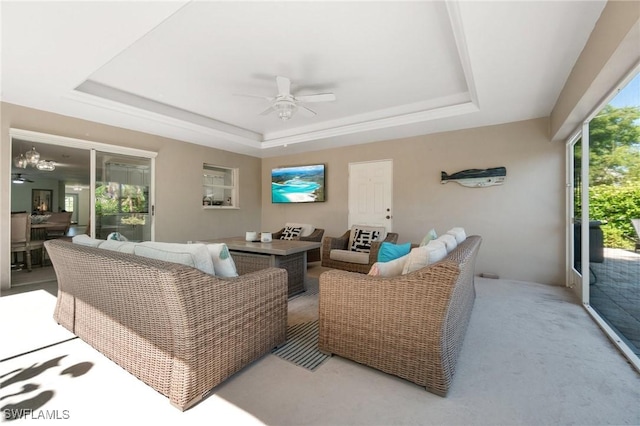 740 106th Ave N, Naples, FL 34108 - living room featuring a raised ceiling, ceiling fan, and light carpet