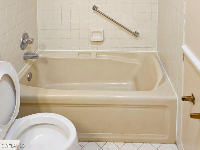 full bath with toilet and tile patterned floors