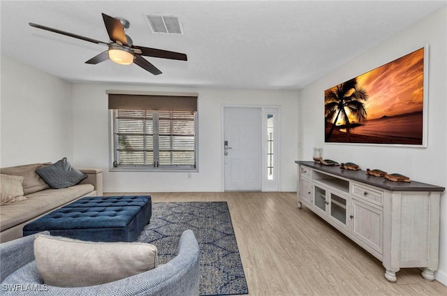 125 Donna Ct, Punta Gorda, FL 33950 - living area with light wood-style floors, ceiling fan, and baseboards
