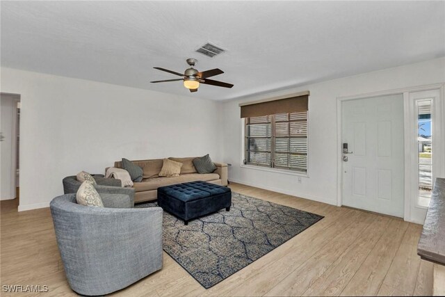 125 Donna Ct, Punta Gorda, FL 33950 - living room with ceiling fan, wood finished floors, and baseboards