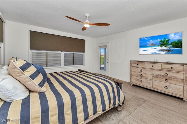 125 Donna Ct, Punta Gorda, FL 33950 - bedroom featuring access to exterior, wood finished floors, and ceiling fan