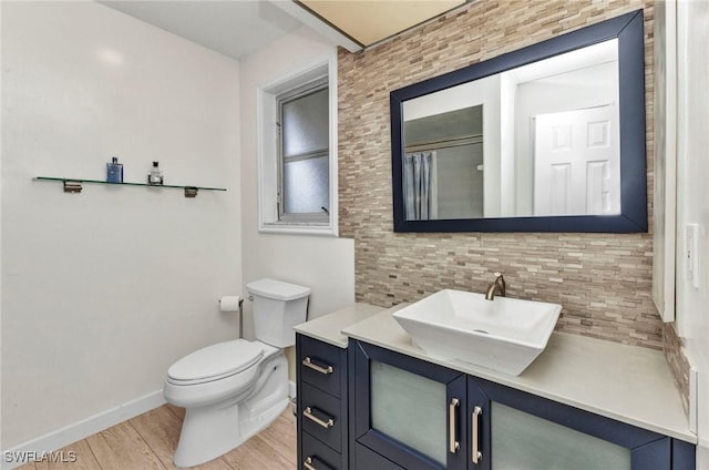 125 Donna Ct, Punta Gorda, FL 33950 - bathroom with wood finished floors, vanity, toilet, baseboards, and a shower with shower curtain