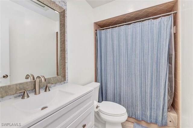 125 Donna Ct, Punta Gorda, FL 33950 - bathroom featuring toilet, vanity, and a shower with shower curtain