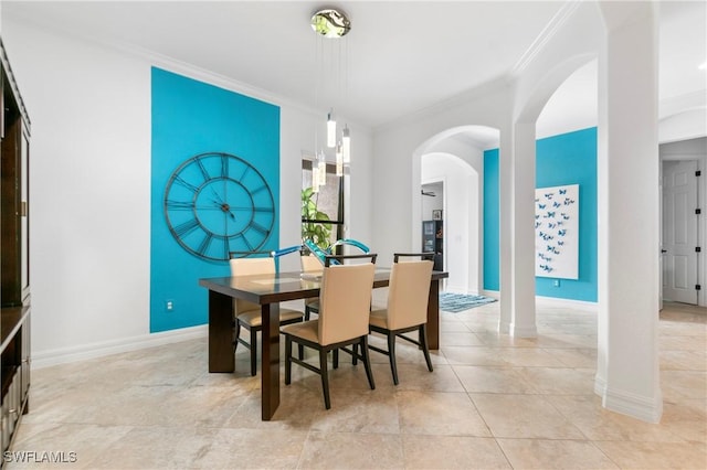10986 Longwing Dr, Fort Myers, FL 33912 - dining room featuring ornamental molding, arched walkways, baseboards, and light tile patterned floors