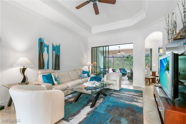 10986 Longwing Dr, Fort Myers, FL 33912 - living area featuring a ceiling fan, a raised ceiling, light tile patterned floors, ornamental molding, and arched walkways
