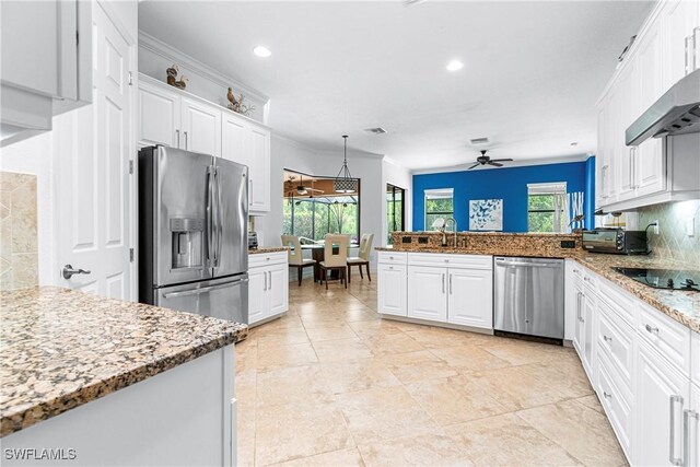 10986 Longwing Dr, Fort Myers, FL 33912 - kitchen with stainless steel appliances, white cabinetry, healthy amount of natural light, recessed lighting, and ornamental molding