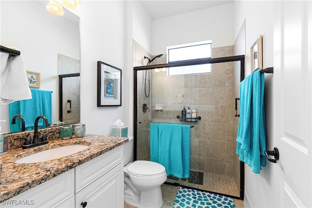 10986 Longwing Dr, Fort Myers, FL 33912 - bathroom with tiled shower, vanity, toilet, and tile patterned flooring
