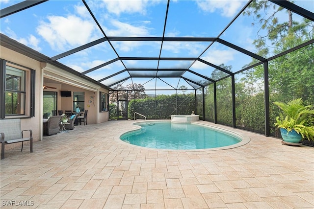 10986 Longwing Dr, Fort Myers, FL 33912 - view of swimming pool featuring a pool with connected hot tub, a patio, a ceiling fan, and glass enclosure
