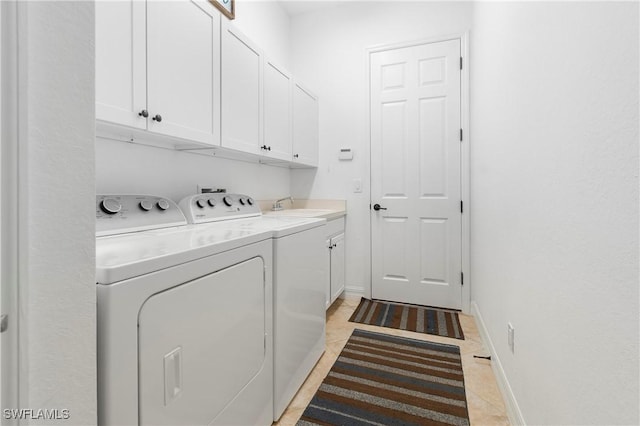 10986 Longwing Dr, Fort Myers, FL 33912 - laundry room with cabinet space, washing machine and dryer, baseboards, and light tile patterned floors