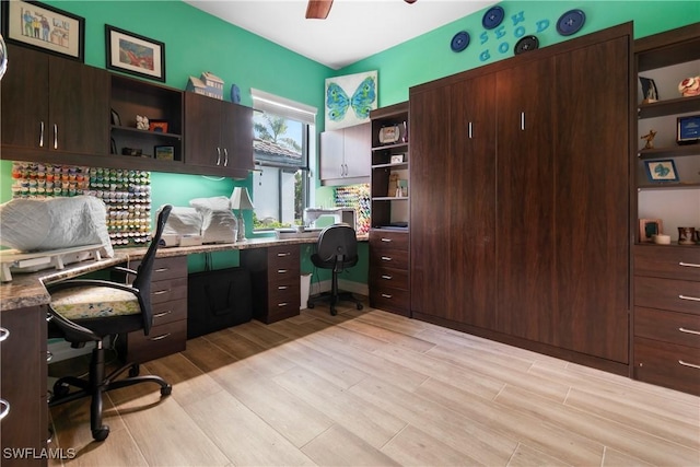 10986 Longwing Dr, Fort Myers, FL 33912 - home office with light wood-style flooring, ceiling fan, and built in study area