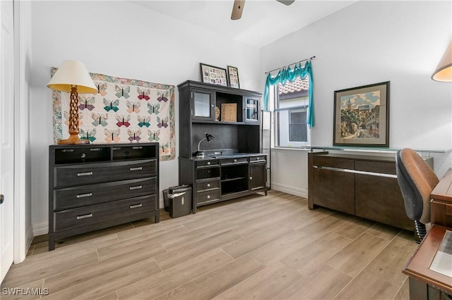 10986 Longwing Dr, Fort Myers, FL 33912 - office with light wood finished floors, ceiling fan, baseboards, and wallpapered walls