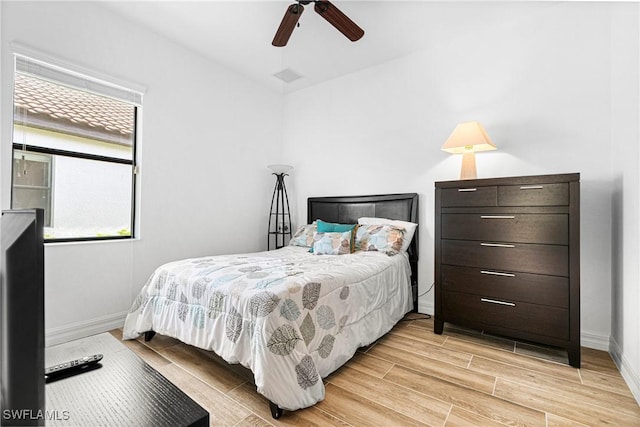 10986 Longwing Dr, Fort Myers, FL 33912 - bedroom featuring wood finish floors, baseboards, and a ceiling fan