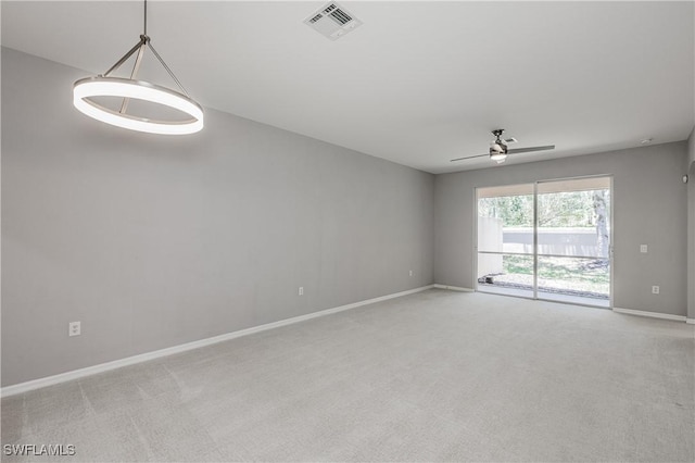 14183 Fall Creek Ct, Naples, FL 34114 - empty room with light colored carpet, baseboards, and ceiling fan