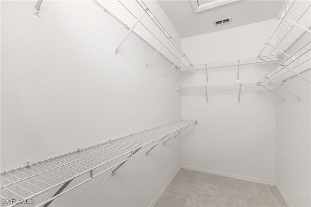 14183 Fall Creek Ct, Naples, FL 34114 - spacious closet featuring light colored carpet
