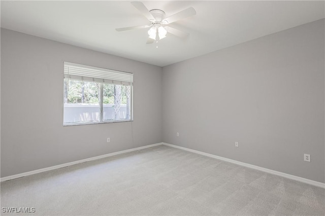 14183 Fall Creek Ct, Naples, FL 34114 - unfurnished room featuring light carpet, baseboards, and a ceiling fan
