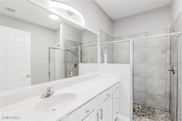 14183 Fall Creek Ct, Naples, FL 34114 - bathroom featuring a stall shower and vanity