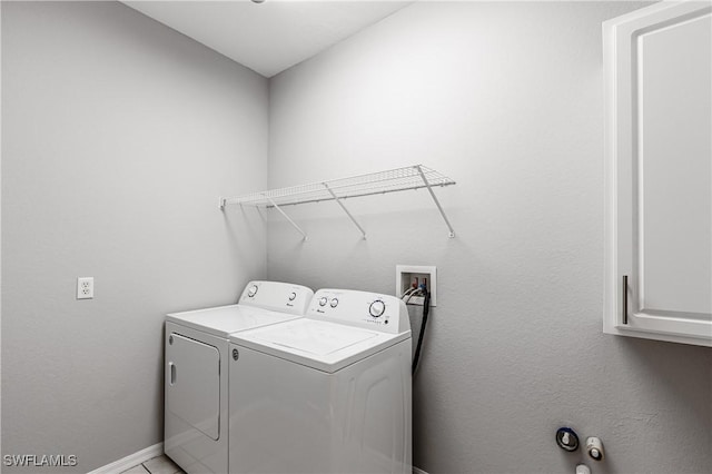 14183 Fall Creek Ct, Naples, FL 34114 - laundry room featuring washer and dryer, baseboards, and cabinet space