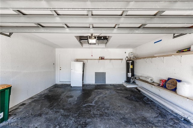 14183 Fall Creek Ct, Naples, FL 34114 - garage featuring electric water heater, freestanding refrigerator, and a garage door opener