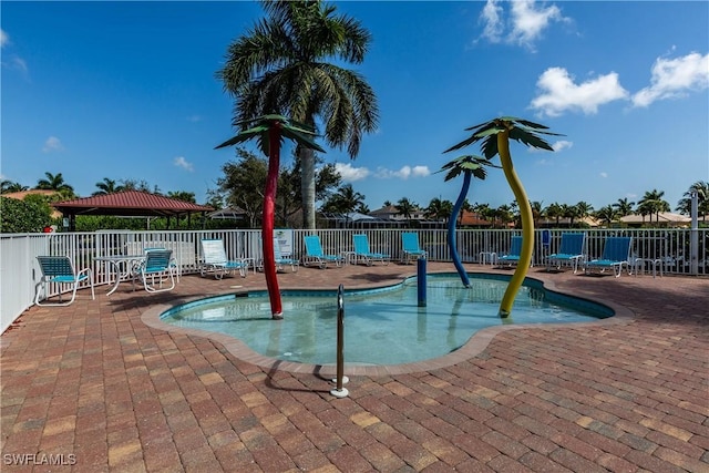 14183 Fall Creek Ct, Naples, FL 34114 - community pool with a patio