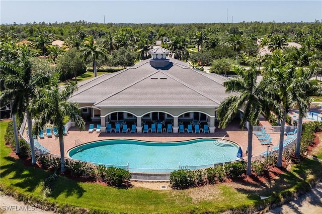 14183 Fall Creek Ct, Naples, FL 34114 - community pool featuring a patio