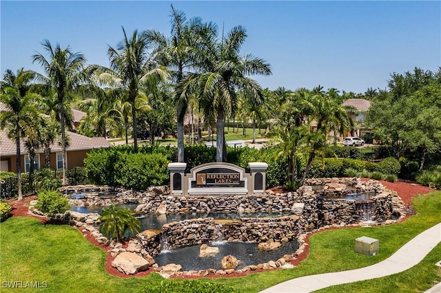 14183 Fall Creek Ct, Naples, FL 34114 - view of home's community featuring a garden pond and a yard