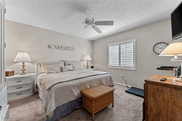 3001 Sandpiper Bay Cir Unit B103, Naples, FL 34112 - carpeted bedroom with a textured ceiling, a ceiling fan, and baseboards