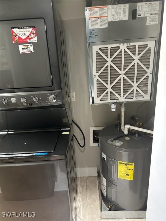 3001 Sandpiper Bay Cir Unit B103, Naples, FL 34112 - utilities with water heater and stacked washer / drying machine